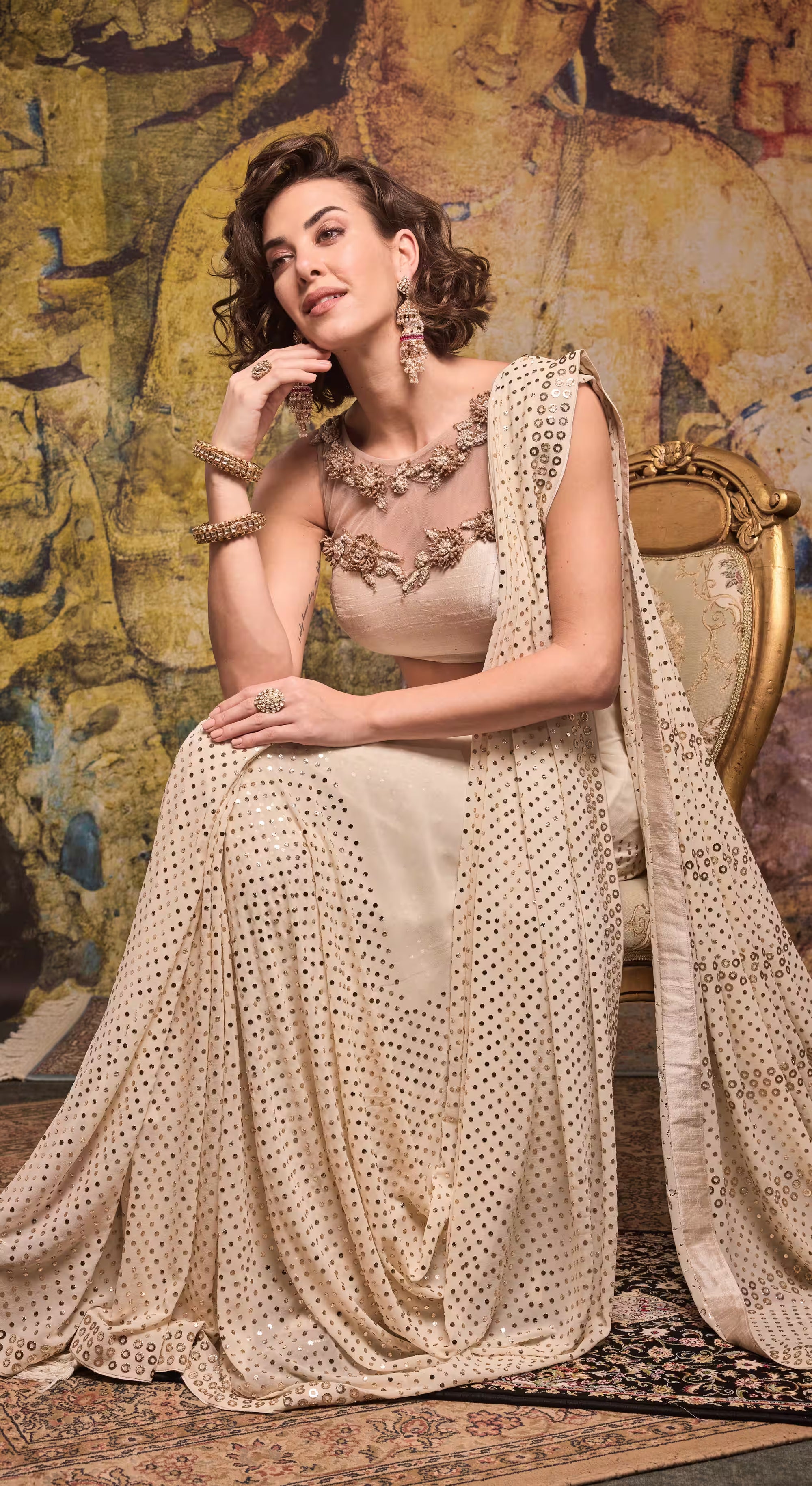 Mirror-Embellished Champagne Georgette Saree with Embroidered Net Blouse